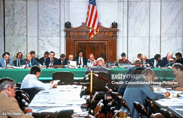 General view of the US Senate Committee on the Judiciary, Washington DC, September 21, 1987. Among those pictured are, seated at green table, from...