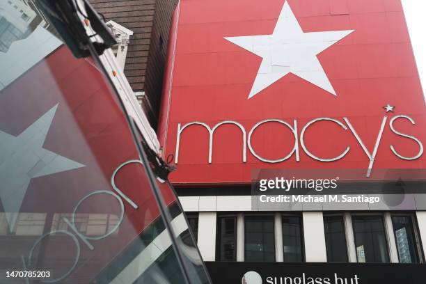 The Macy's company signage is seen at the Herald Square store on March 02, 2023 in New York City. Macy's Inc. Stock jumped 14.8% in premarket trade...