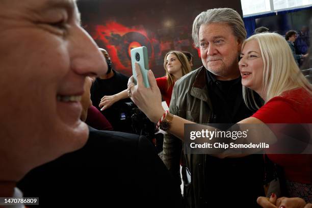 Steve Bannon, former advisor to former President Donald Trump and media executive, poses for selfies with supporters during the Conservative...