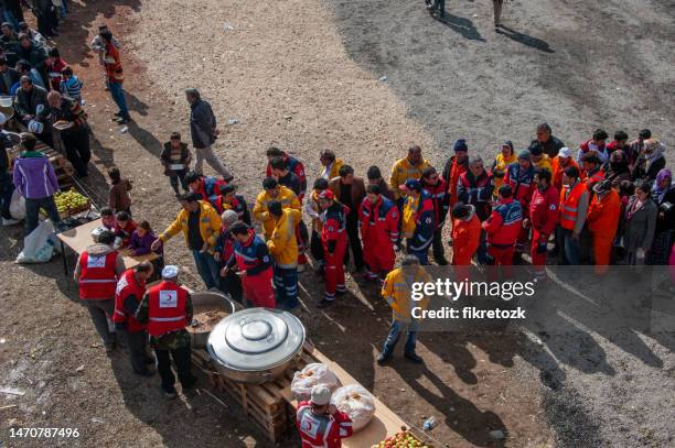 volunteers during the dinner in van earthquake - refugee tent stock pictures, royalty-free photos & images