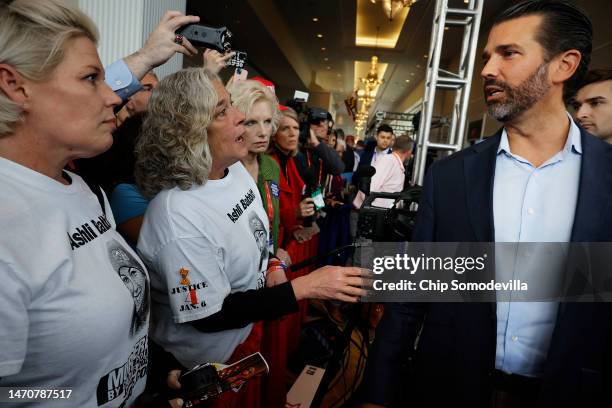 Micki Witthoeft , mother of Ashli Babbitt, talks with Donald Trump Jr. During the Conservative Political Action Conference at Gaylord National Resort...