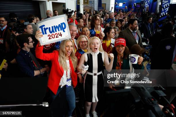 Jayne Zirkle , reporter for Steve Bannon's War Room, leads attendees in cheers while broadcasting from the Conservative Political Action Conference...