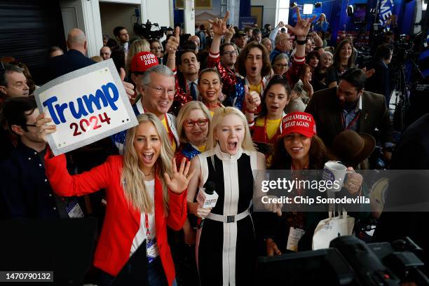 Jayne Zirkle , reporter for Steve Bannon's War Room, leads attendees in cheers while broadcasting from the Conservative Political Action Conference...