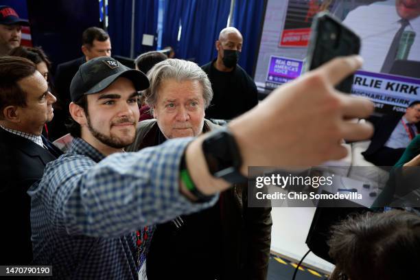Steve Bannon, former advisor to former President Donald Trump and media executive, poses for selfies with supporters during the Conservative...