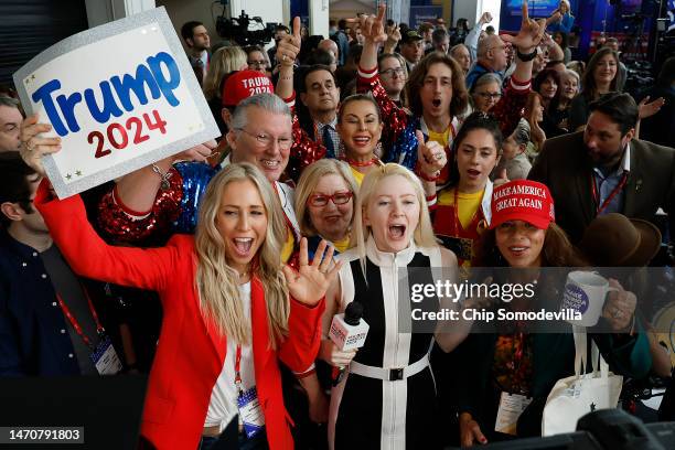 Jayne Zirkle , reporter for Steve Bannon's War Room, leads attendees in cheers while broadcasting from the Conservative Political Action Conference...