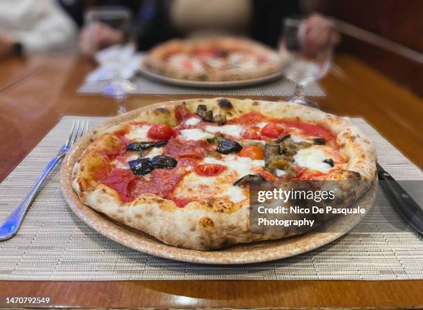 close-up of traditional neapolitan pizza in naples, italy - napoli pizza stock pictures, royalty-free photos & images