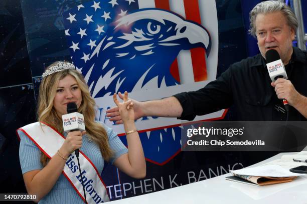 War Room co-host Natalie Winters , dons a crown and sash that reads "Miss Information" with Steve Bannon, former advisor to former President Donald...