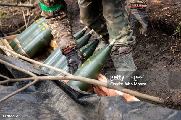 Members of Ukraine's 10th Mountain Brigade prepare to fire 122mm artillery shells at Russian troops on March 02, 2023 in the Donetsk Region of...