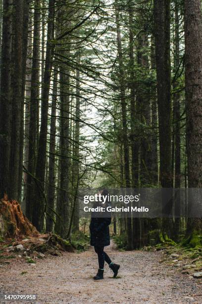 woman in the woods - north vancouver stock pictures, royalty-free photos & images