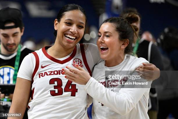 Chrissy Carr and Avery Hughes of the Arkansas Razorbacks celebrate their win over the Missouri Tigers during the second round of the SEC Women's...