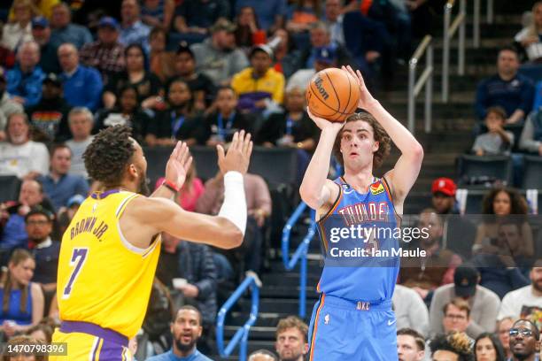 Josh Giddey of the Oklahoma City Thunder shoots over Troy Brown Jr. #7 of the Los Angeles Lakers during the third quarter at Paycom Center on March...