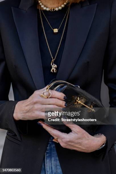 Influencer and style icon Annette Weber, wearing a black blazer by Boss, jewelry by Ole Lynggaard, a black varnish bag by Paris 64, during a...