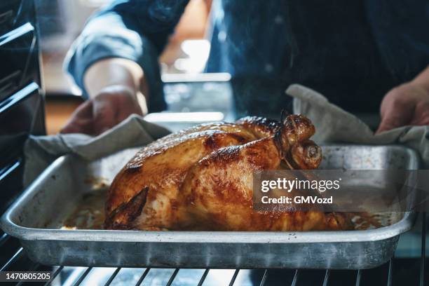 roasted chicken with root vegetables - chicken roasting oven stock pictures, royalty-free photos & images