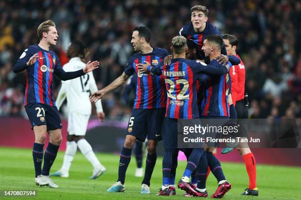 Barcelona celebrate their team's first goal, an own goal scored by Eder Militao of Real Madrid during the Copa Del Rey Semi Final Leg One match...