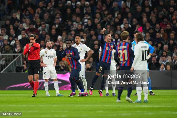 Barcelona players celebrate their team's first goal, an own goal scored by Eder Militao of Real Madrid during the Copa Del Rey Semi Final Leg One...