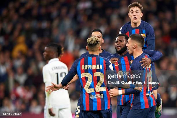 Players of FC Barcelona celebrates after their side's first goal, an own goal scored by Eder Militao of Real Madrid during the Copa del Rey semifinal...