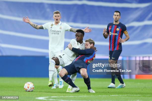 Vinicius Junior of Real Madrid and Frenkie de Jong of FC Barcelona clash during the Copa Del Rey Semi Final Leg One match between Real Madrid CF and...