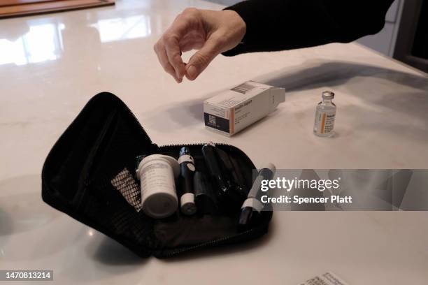 Elizabeth Snouffer, whose had type 1 diabetes for most of her life, displays her insulin kit which she needs to take daily on March 02, 2023 in New...