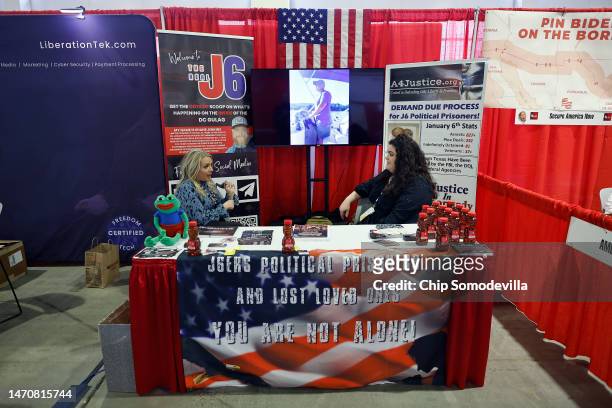 Organizations supporting people arrested during the January 6, 2021 attack on the U.S. Capitol host a booth in the expo hall of the Conservative...