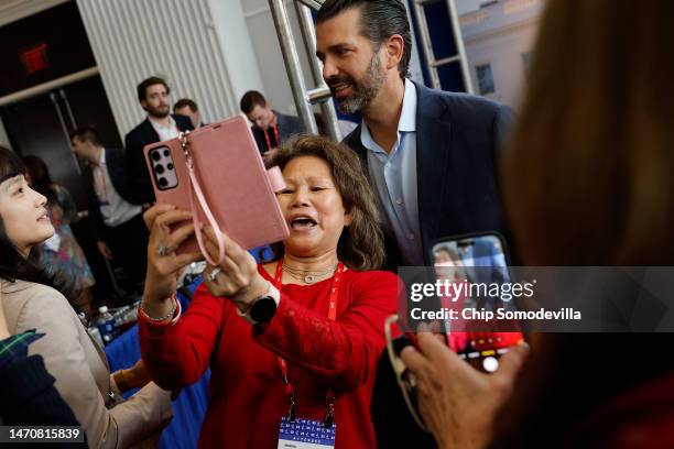 Donald Trump Jr. Poses for a selfie with supporters during the Conservative Political Action Conference at Gaylord National Resort Hotel And...