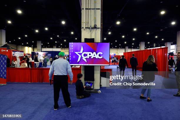 Attendees visit booths promoting political organizations along side products like perfume and cigars in the expo hall of the Conservative Political...