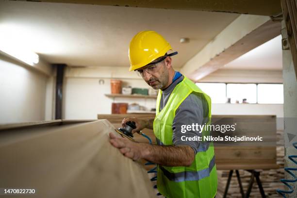 carpenter with his power sander - inside coffin stock pictures, royalty-free photos & images