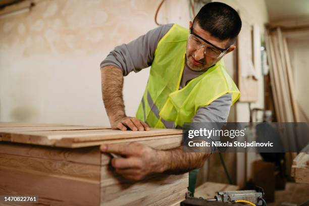 carpenters in their factory - coffin stockfoto's en -beelden