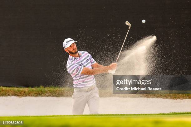Max Homa of the United States plays a shot from a greenside bunker on the 14th hole during the first round of the Arnold Palmer Invitational...
