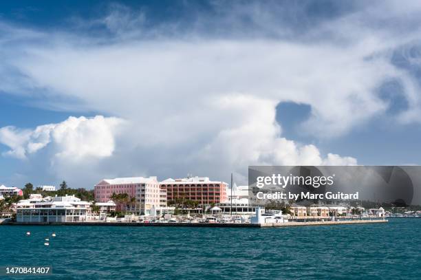 storm cloud behind hamilton, bermuda - hamilton bermuda stock pictures, royalty-free photos & images