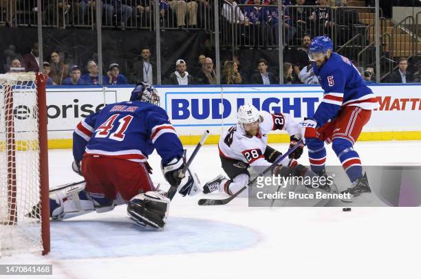 H41#2 and Ben Harpur of the New York Rangers defend against Claude Giroux of the Ottawa Senators during the first period at Madison Square Garden on...