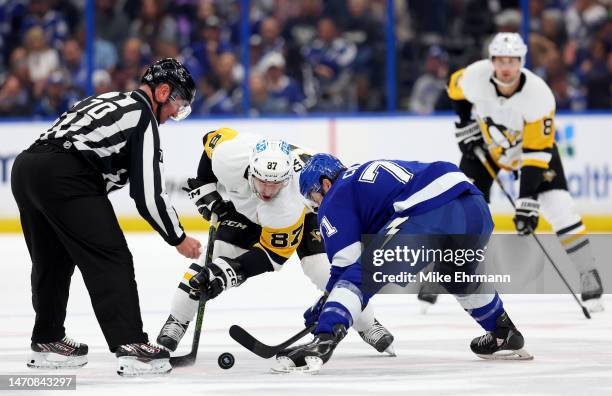 Sidney Crosby of the Pittsburgh Penguins and Anthony Cirelli of the Tampa Bay Lightning face off in the first period during a game at Amalie Arena on...