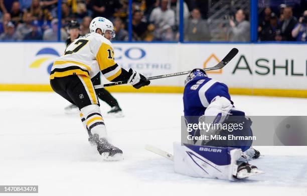 Andrei Vasilevskiy of the Tampa Bay Lightning stops a shot from Bryan Rust of the Pittsburgh Penguins during a game at Amalie Arena on March 02, 2023...