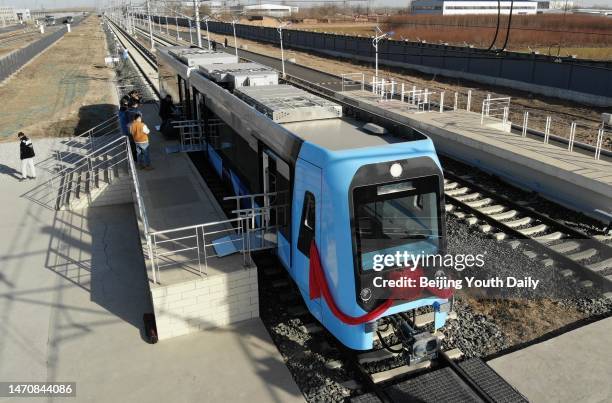 Hydrogen fuel cell hybrid articulated light rail vehicle rolls off the production line at an intelligent manufacturing base of Hebei Jingche Rail...