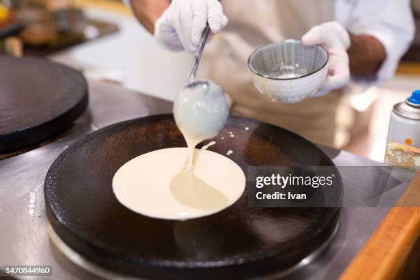 cooking a french crepe, pancake in a pan with mixed berry and cream - maslenitsa stock pictures, royalty-free photos & images