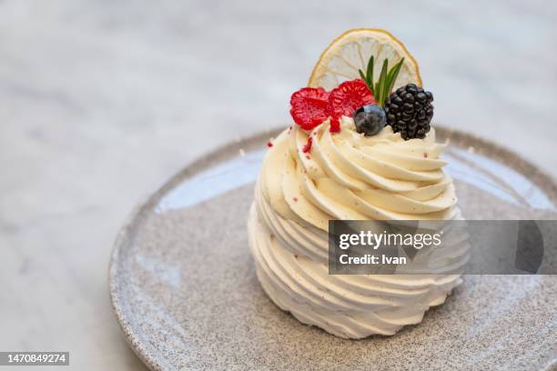 meringue  cake with berry and lemon decoration - atlanta georgia food stock pictures, royalty-free photos & images