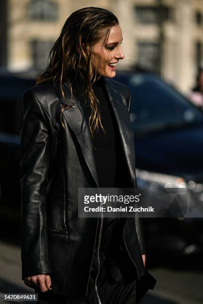 Olivia Palermo is seen wearing a black leather coat outside the Givenchy show during Paris Fashion Week F/W 2023 on March 02, 2023 in Paris, France.