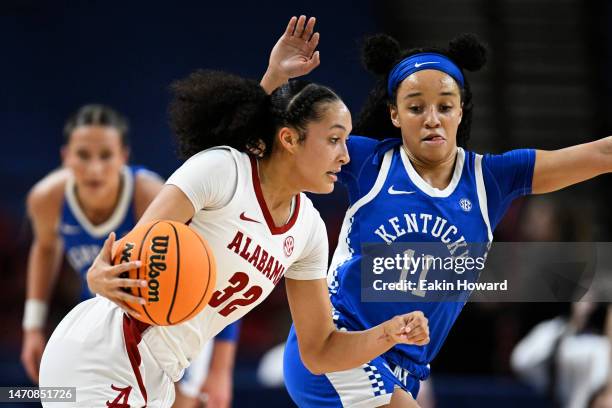 Aaliyah Nye of the Alabama Crimson Tide drives against Jada Walker of the Kentucky Wildcats in the second quarter during the second round of the SEC...