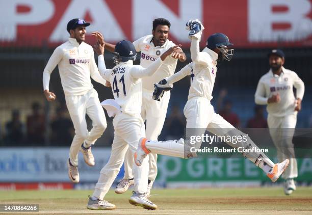 Ravichandran Ashwin of India celebrates taking the wicket of Usman Khawaja of Australia during day three of the Third Test match in the series...