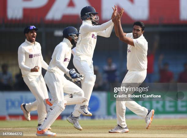 Ravichandran Ashwin of India celebrates taking the wicket of Usman Khawaja of Australia during day three of the Third Test match in the series...