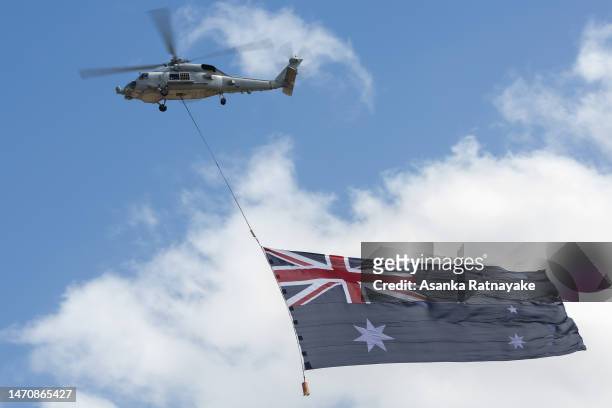 The Royal Australian Navy's MH-60R Seahawk is flying carrying the Australian Flag on March 03, 2023 in Avalon, Australia. The 2023 Australian...
