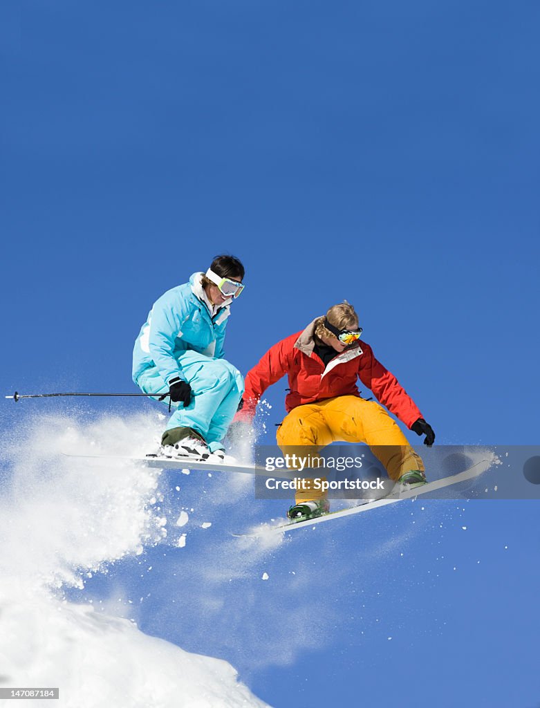 Snowboarder Against Ski Jumper