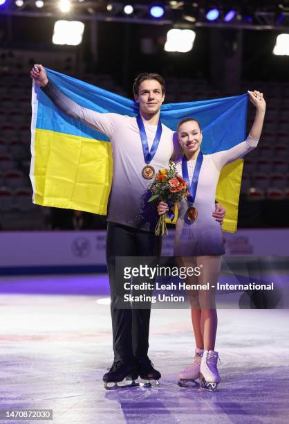 Violetta Sierova and Ivan Khobta of Ukraine, pose for photos after placing third in the Junior Pairs during the ISU World Junior Figure Skating...