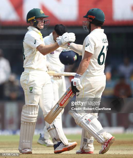Marnus Labuschagne and Travis Head of Australia celebrate after Australia defeated India during day three of the Third Test match in the series...