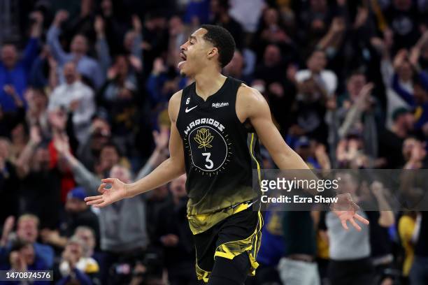 Jordan Poole of the Golden State Warriors reacts after making a three-point basket against the LA Clippers at Chase Center on March 02, 2023 in San...