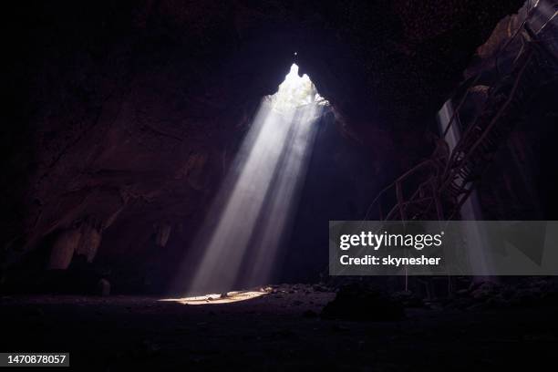 sunlight through the cave hole. - caves bildbanksfoton och bilder