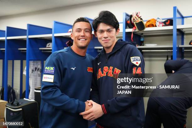 Outfielder Lars Nootbaar and Pitcher Roki Sasaki of Samurai Japan pose in the locker room prior to the practice game between Samura Japan and...