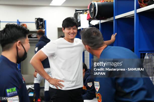 Pitcher Shohei Ohtani and Outfielder Lars Nootbaar of Samurai Japan talk in the locker room prior to the practice game between Samura Japan and...