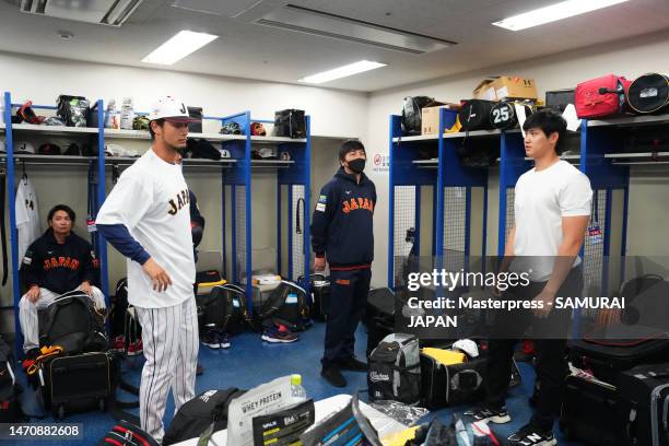 Pitcher Shohei Ohtani and Pitcher Yu Darvish of Samurai Japan talk in the locker room prior to the practice game between Samura Japan and Chunichi...