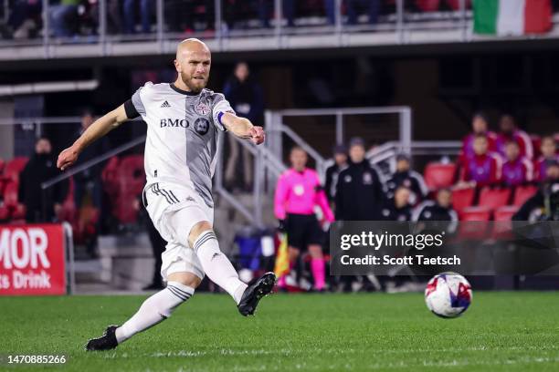 Michael Bradley of Toronto FC kicks the ball against DC United during the first half of the MLS game at Audi Field on February 25, 2023 in...