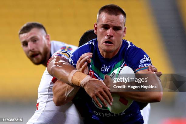Jackson Ford of the Warriors charges forward during the round one NRL match between the New Zealand Warriors and Newcastle Knights at Sky Stadium on...